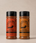 Two 5oz bottles of Lake Spices Rubs, one of Foundry Original BBQ Rub, one of Canyon Southwestern Rub.