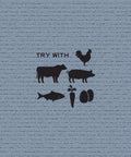 Product use suggestions: text reading “Try With,” and black icons of a rooster, cow, pig, fish, carrot, and eggs, against a blue-grey background.